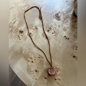 Leather necklace with stones inside